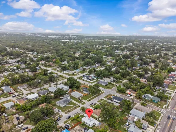 an aerial view of residential building with green space