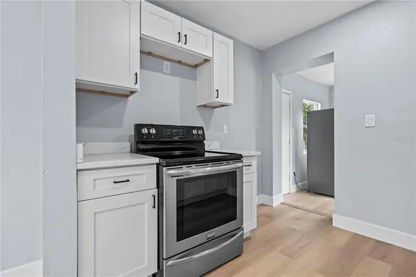 a kitchen with a stove and a sink