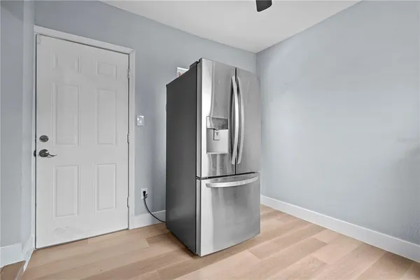 a view of a refrigerator in kitchen and cabinetry