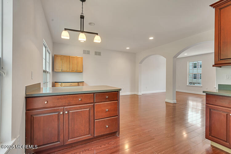 19 Russell Court Matawan, NJ 07747 - Photo 11 of 29 a view of a kitchen with cabinets and wooden floor