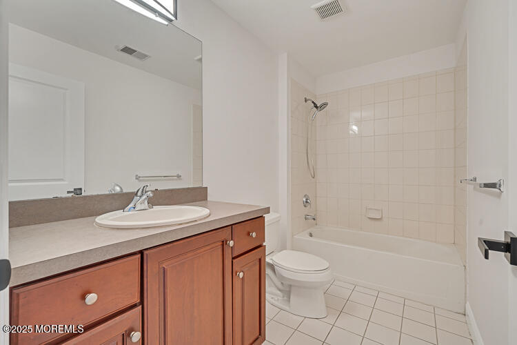 19 Russell Court Matawan, NJ 07747 - Photo 13 of 29 a bathroom with a sink a toilet and shower