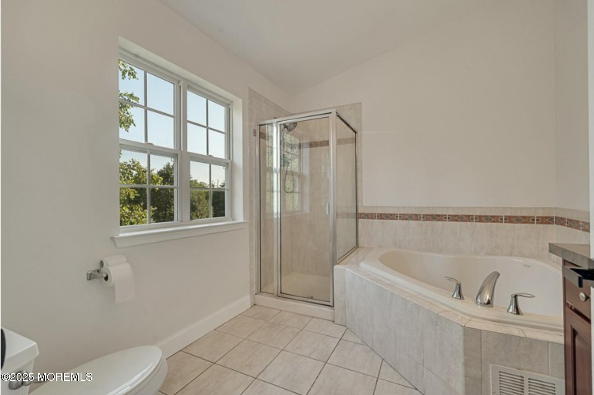 19 Russell Court Matawan, NJ 07747 - Photo 17 of 29 a bathroom with a bathtub and shower