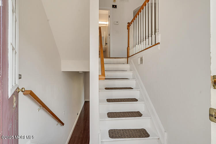 19 Russell Court Matawan, NJ 07747 - Photo 3 of 29 a view of staircase with white walls and a window