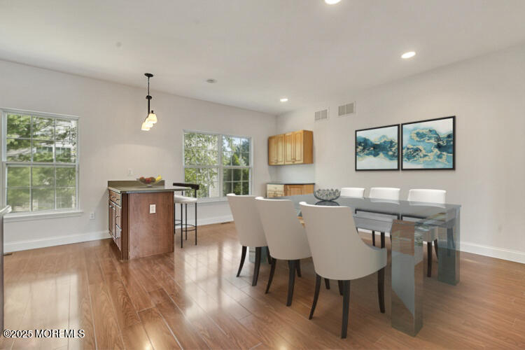 19 Russell Court Matawan, NJ 07747 - Photo 7 of 29 a view of a dining room with furniture window and wooden floor