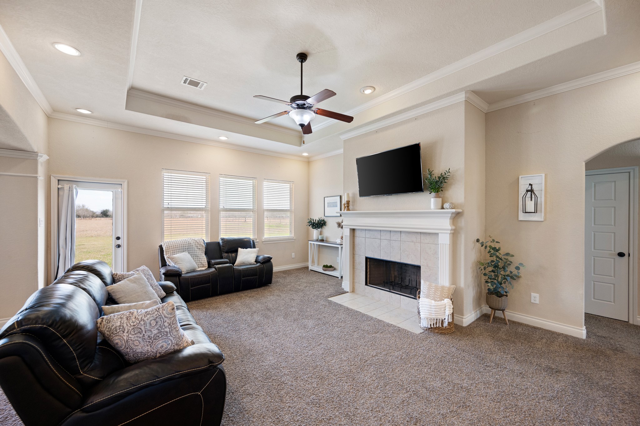 8131 Brinkmeyer Road Needville, TX 77461 - Photo 8 of 34 This is a spacious living room with neutral tones and the large windows provide ample natural light.