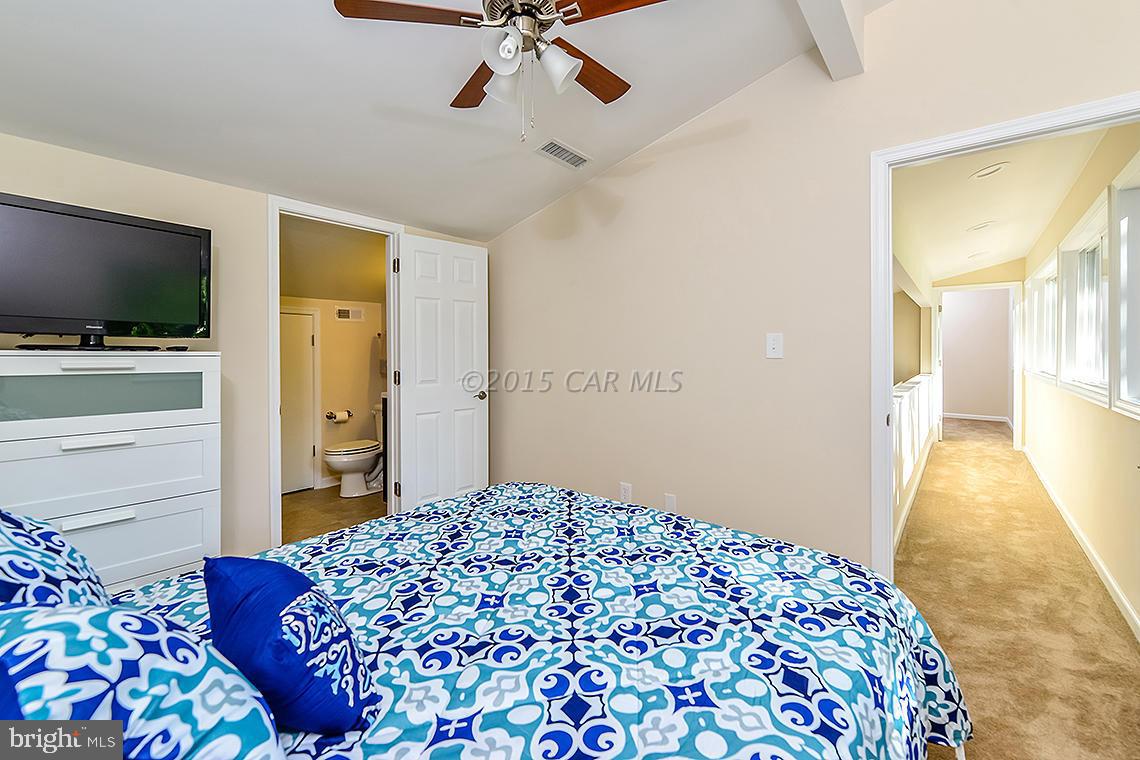 20 Battersea Road Ocean Pines, MD 21811 - Photo 22 of 40 a bedroom with a bed and a flat screen tv