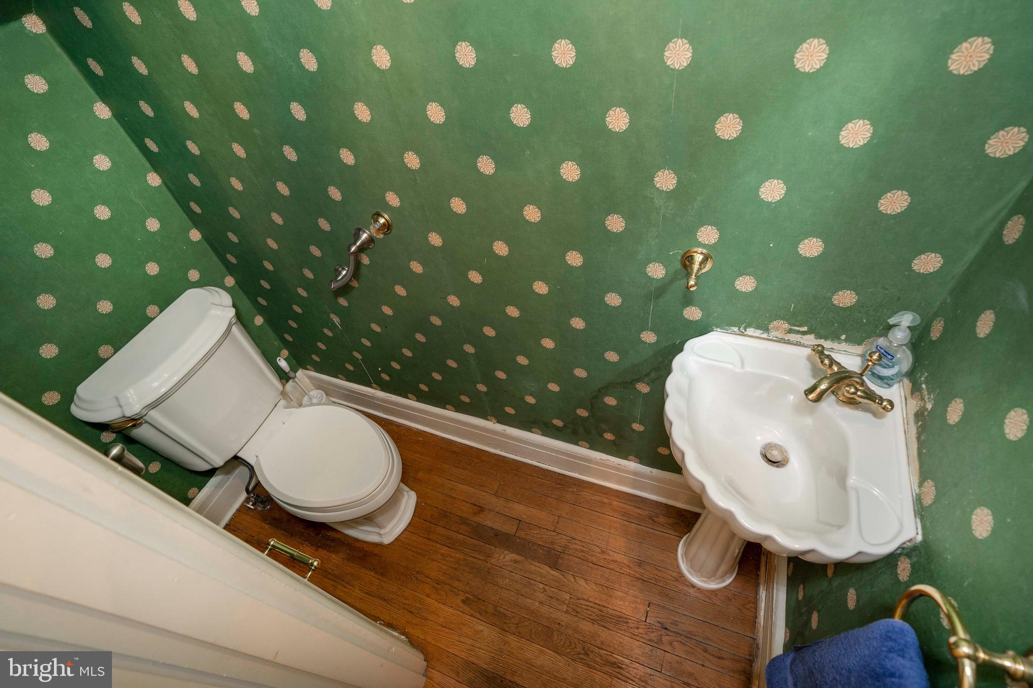 726 Nottingham Road Wilmington, DE 19805 - Photo 34 of 67 First floor powder room with hardwood floors