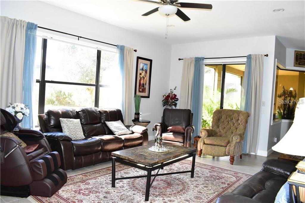 20104 Pond Spring Way Tampa, FL 33647 - Photo 12 of 51 a living room with furniture and a window