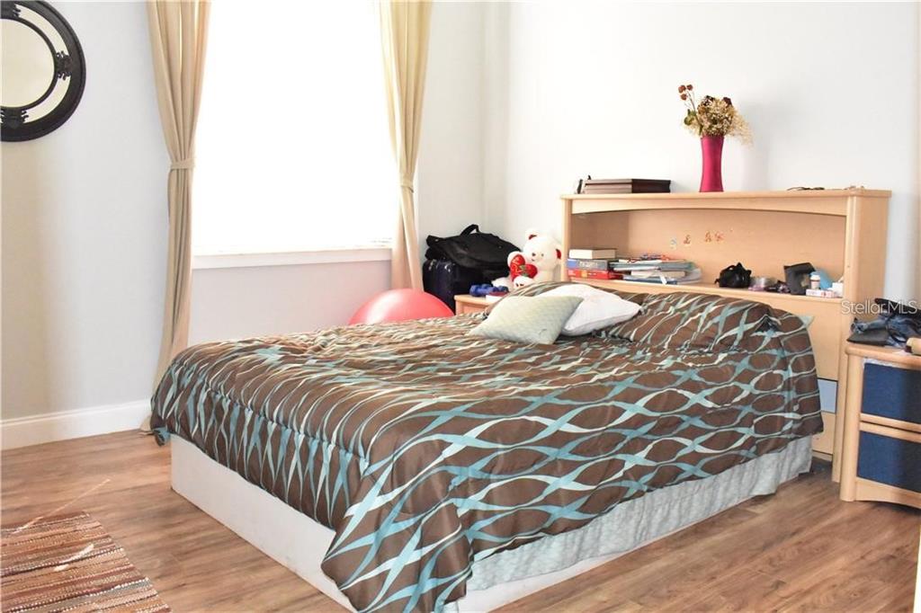 20104 Pond Spring Way Tampa, FL 33647 - Photo 17 of 51 a bedroom with a bed and a window