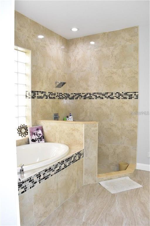 20104 Pond Spring Way Tampa, FL 33647 - Photo 22 of 51 a bathroom with a sink and a mirror