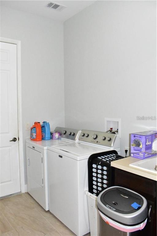 20104 Pond Spring Way Tampa, FL 33647 - Photo 27 of 51 a room with a white stove top oven and sink