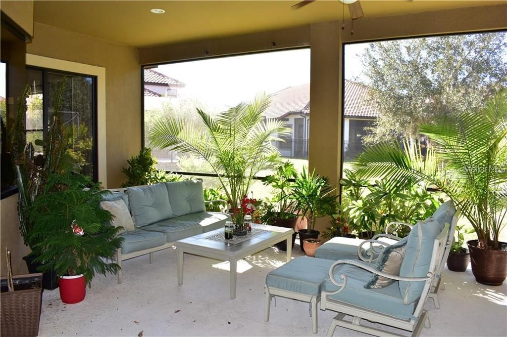 20104 Pond Spring Way Tampa, FL 33647 - Photo 29 of 51 a outdoor living space with furniture and garden view