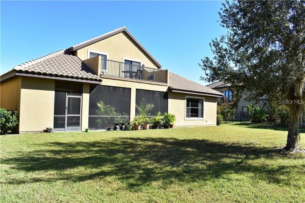 20104 Pond Spring Way Tampa, FL 33647 - Photo 31 of 51 a front view of a house with a yard