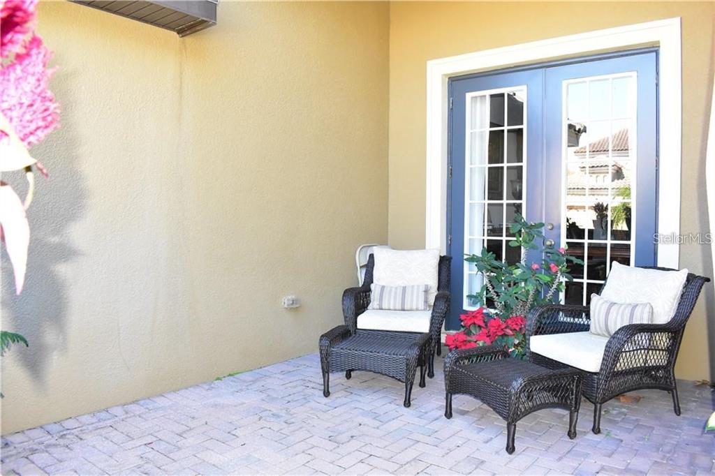 20104 Pond Spring Way Tampa, FL 33647 - Photo 4 of 51 a living room with furniture and flowers