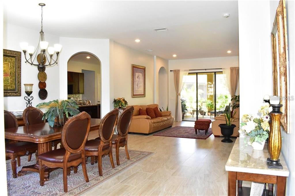 20104 Pond Spring Way Tampa, FL 33647 - Photo 5 of 51 a living room with furniture and wooden floor