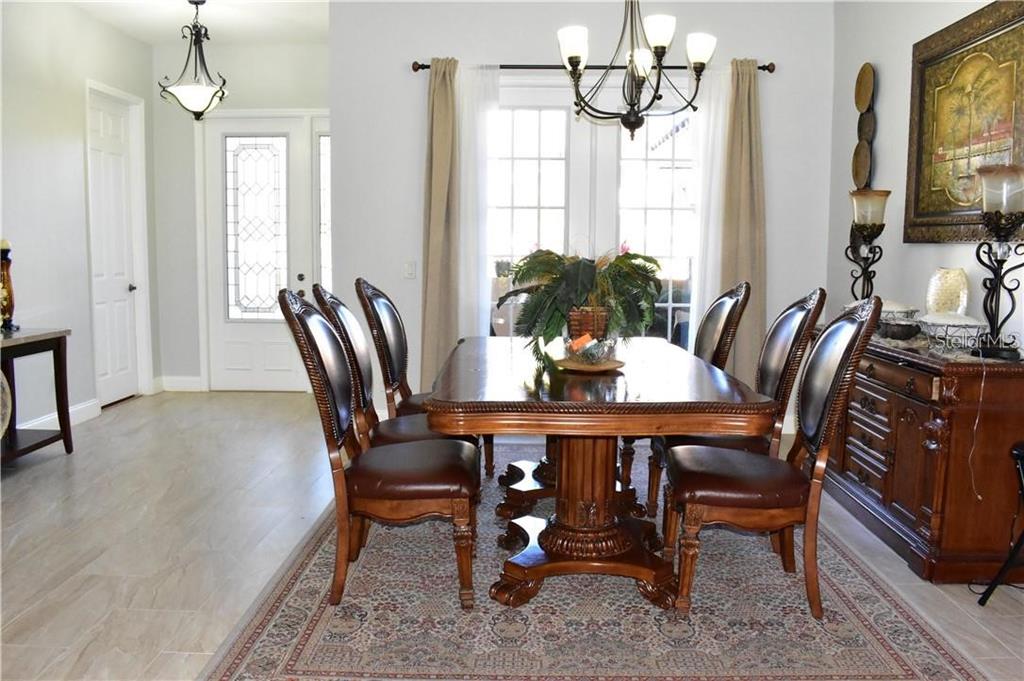 20104 Pond Spring Way Tampa, FL 33647 - Photo 6 of 51 a dining room with furniture and window
