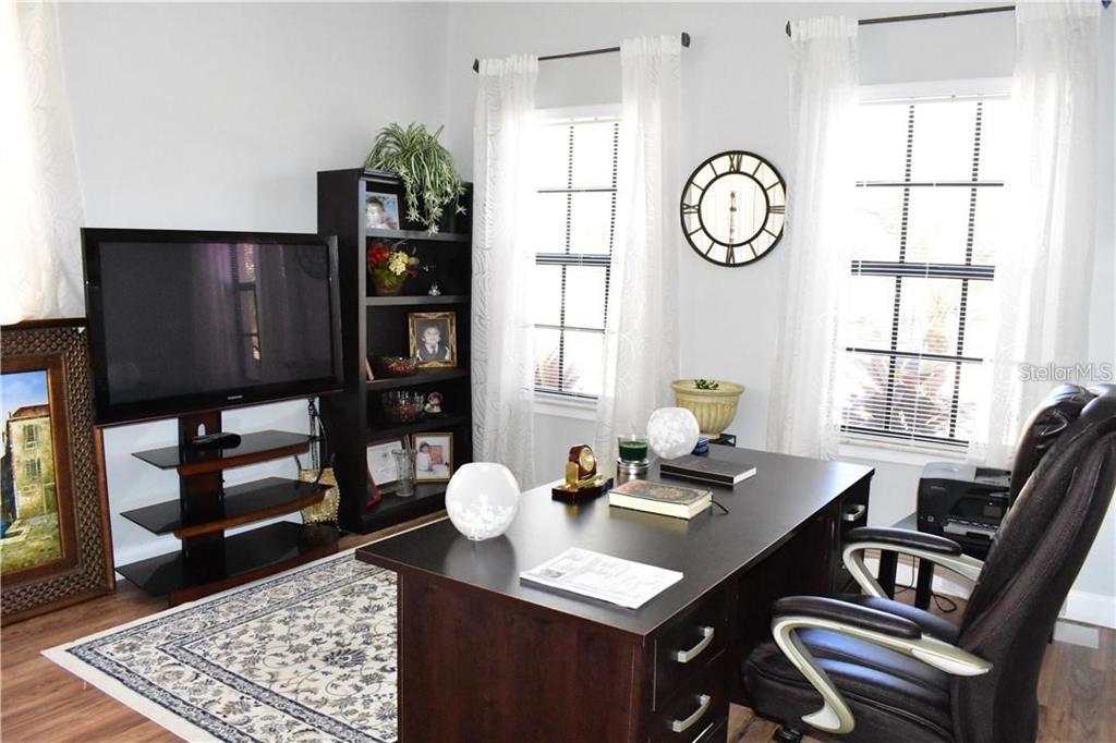 20104 Pond Spring Way Tampa, FL 33647 - Photo 10 of 51 a view of a dining room with furniture and a window