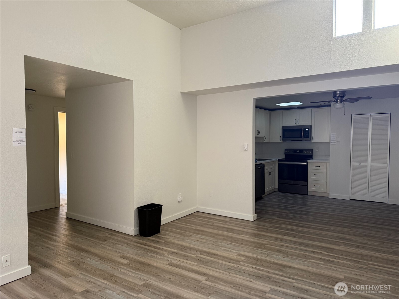 14600 Southeast 176th Street, Unit A3 Renton, WA 98058 - Photo 2 of 7 a view of a kitchen with wooden floor and cabinets