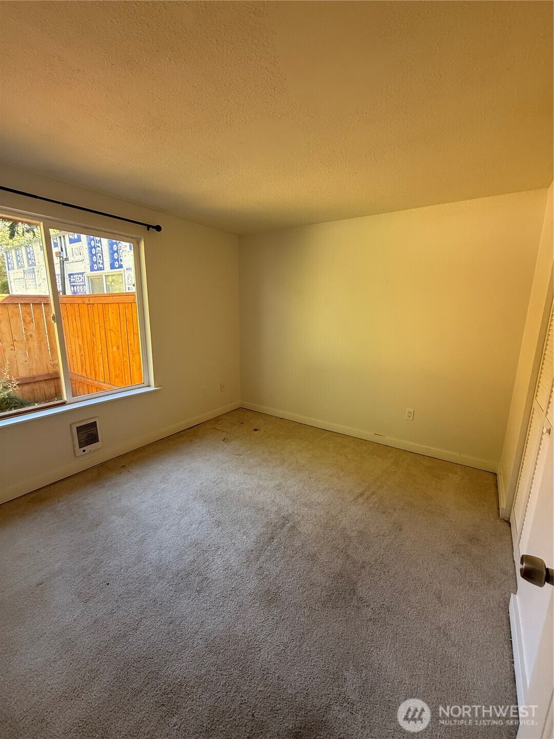 14600 Southeast 176th Street, Unit A3 Renton, WA 98058 - Photo 5 of 7 an empty room with windows