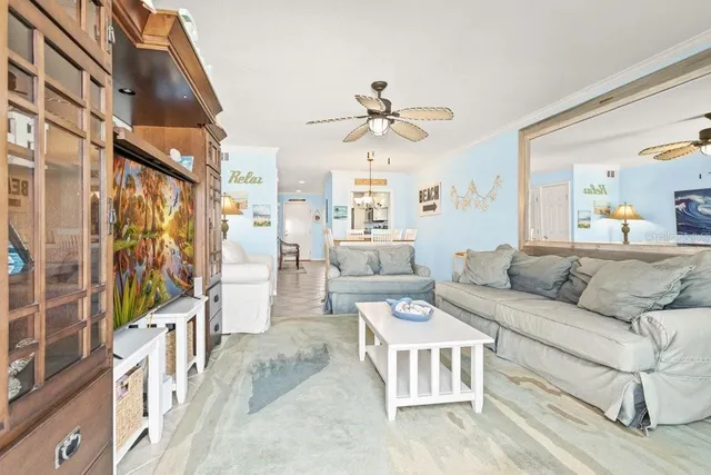 a living room with furniture a large window with outer view