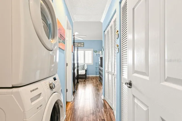 a bathroom with a granite countertop sink a mirror and a shower