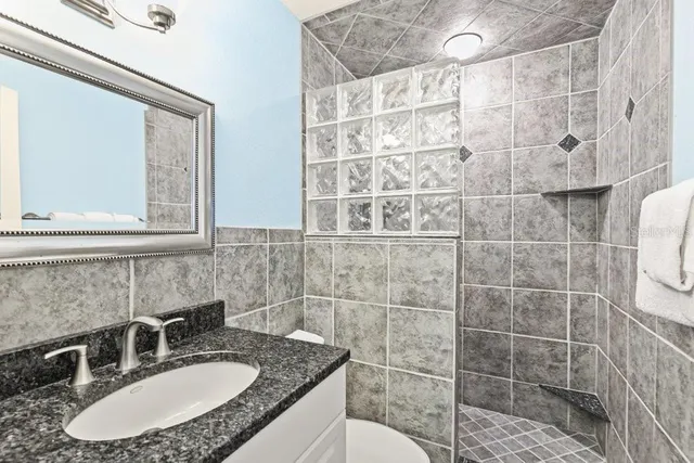 a bedroom with furniture and a large window