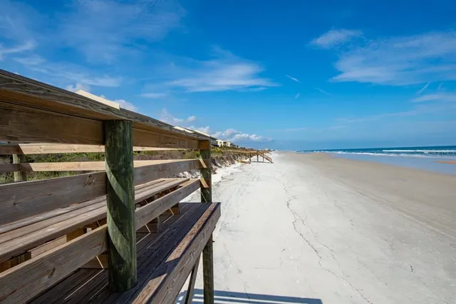 a view of a swimming pool with outdoor seating