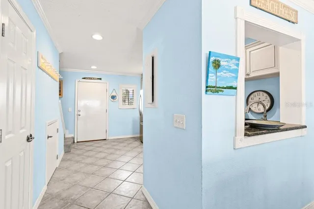 a dining room with furniture a livingroom and chandelier