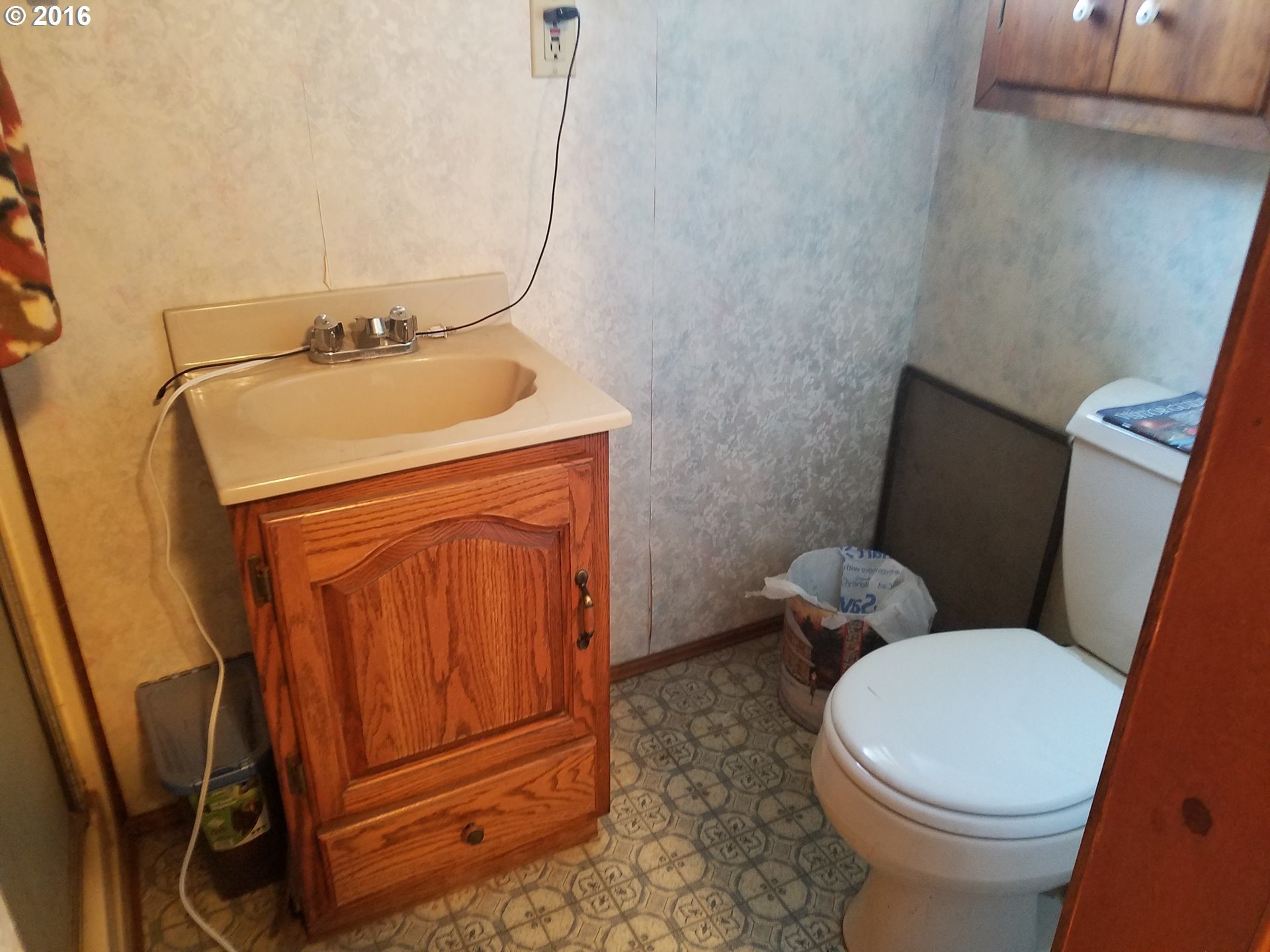 1807 Southwest Goodwin Place Pendleton, OR 97801 - Photo 13 of 24 a bathroom with a toilet and a sink