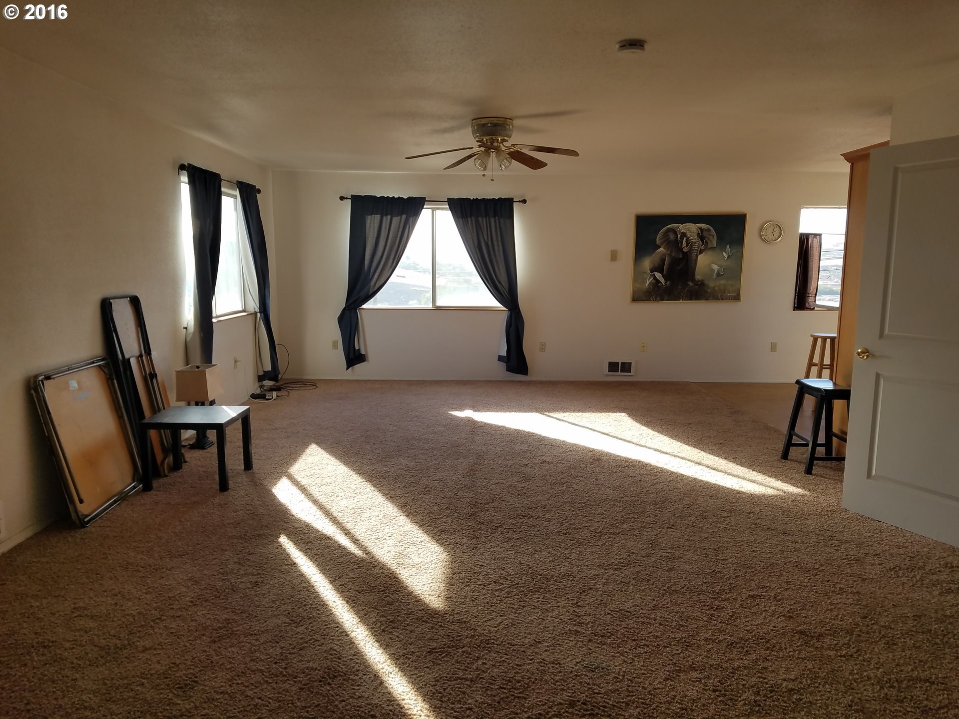 1807 Southwest Goodwin Place Pendleton, OR 97801 - Photo 15 of 24 a living room with furniture a window and a rug