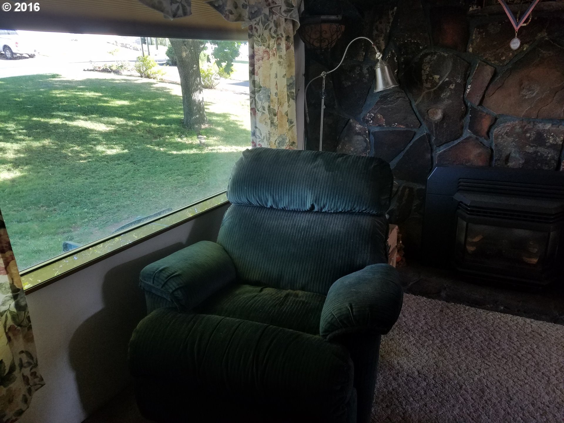 1807 Southwest Goodwin Place Pendleton, OR 97801 - Photo 7 of 24 a living room with a couch and a fireplace
