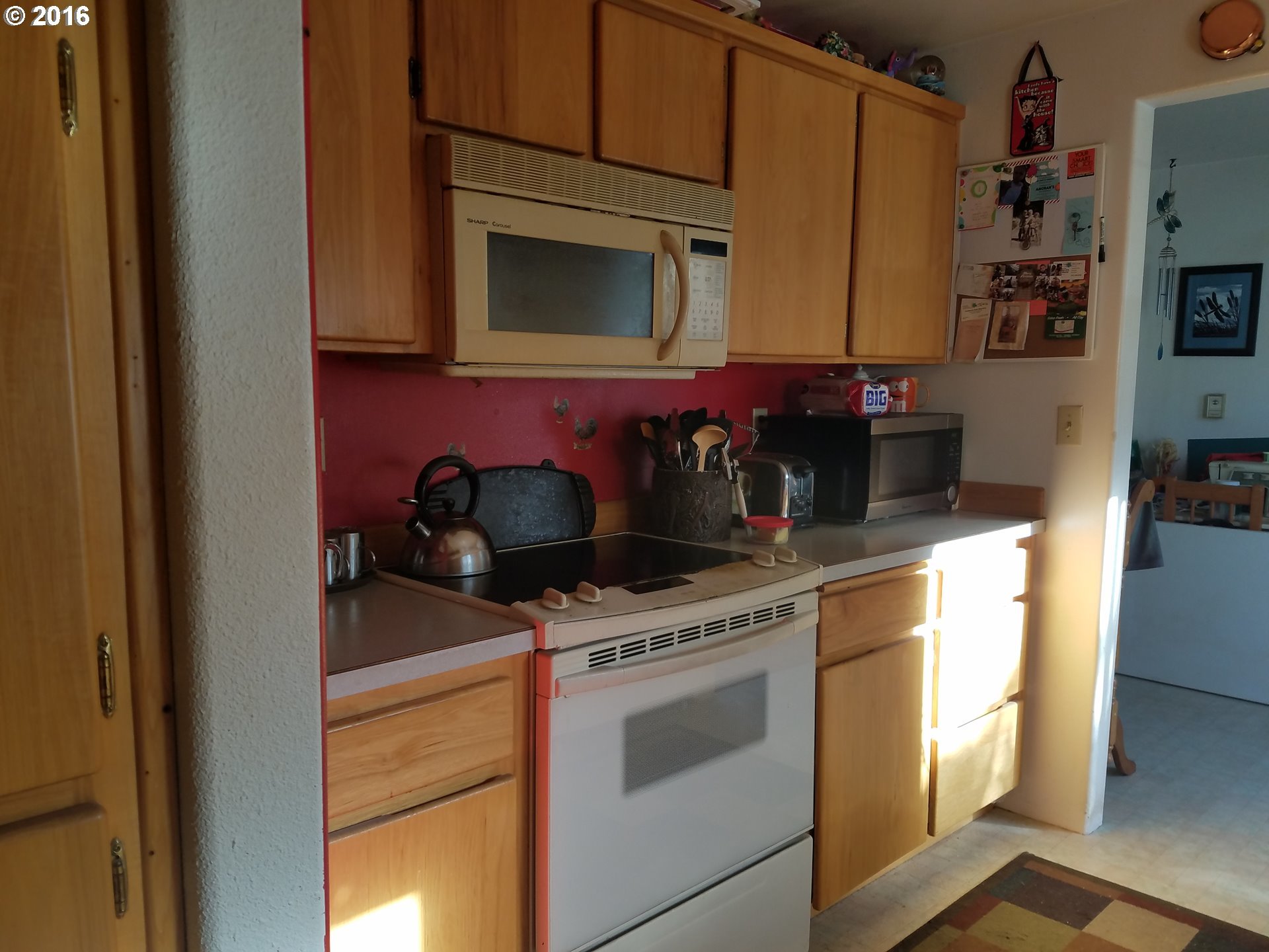 1807 Southwest Goodwin Place Pendleton, OR 97801 - Photo 8 of 24 a kitchen with stainless steel appliances granite countertop a stove and a microwave