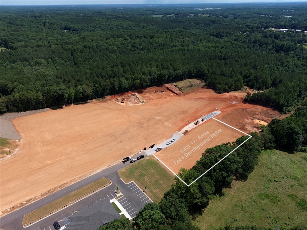 0 Blue Ridge Boulevard West Union, SC 29696 - Photo 10 of 15 An aerial perspective reveals a prime development lot nestled against a lush forest backdrop, ready for construction.