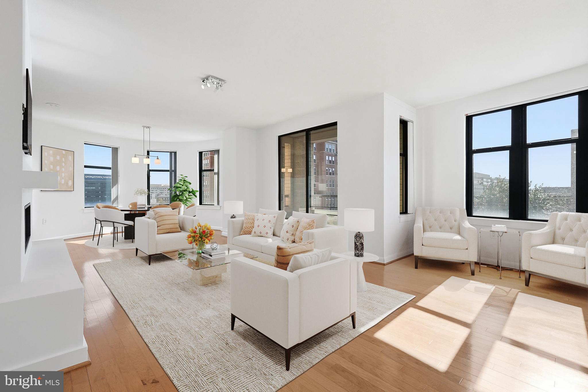 400 Massachusetts Avenue Northwest, Unit 719 Washington, DC 20001 - Photo 1 of 38 a living room with furniture and large windows