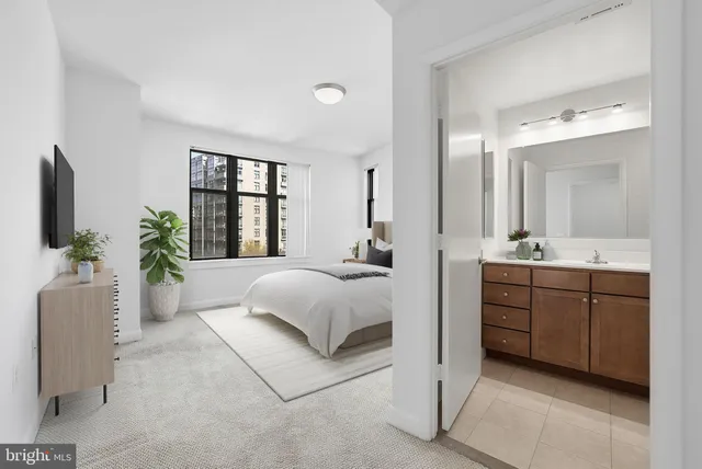 a spacious bedroom with a large bed and a couch