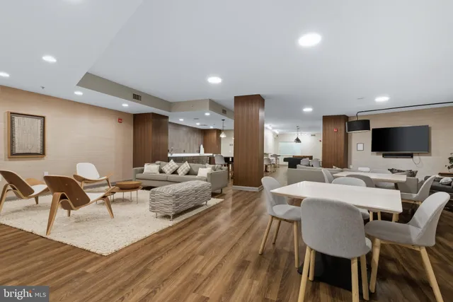 a kitchen with kitchen island stainless steel appliances a stove center island and cabinets