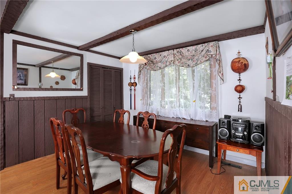 16 Joline Road Kendall Park, NJ 08824 - Photo 12 of 23 a view of a dining room with furniture and chandelier