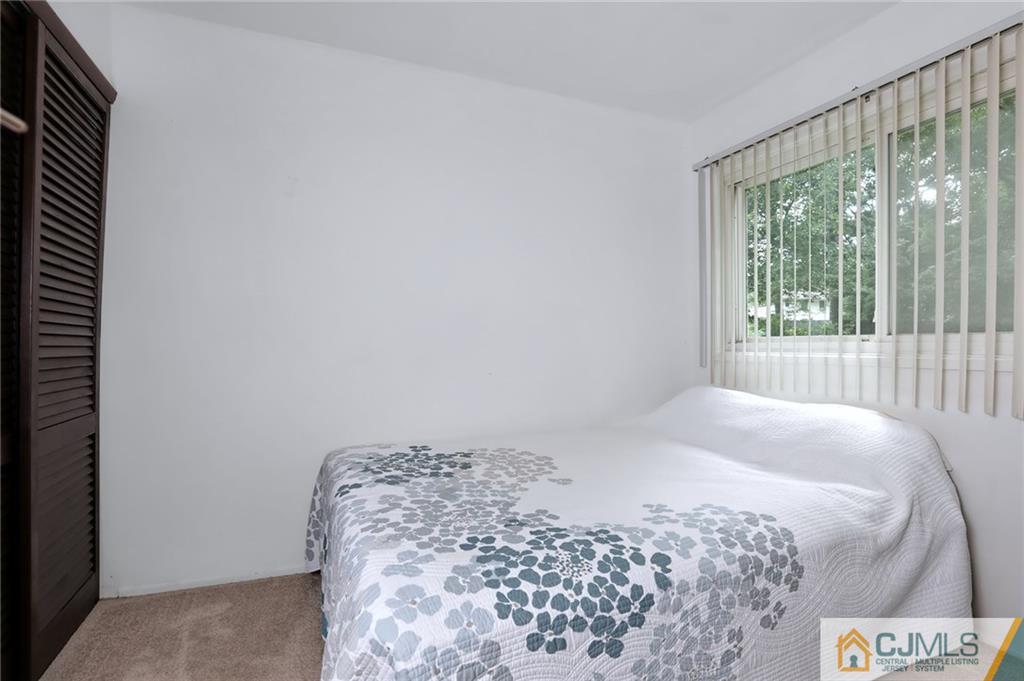 16 Joline Road Kendall Park, NJ 08824 - Photo 16 of 23 a bedroom with a bed and a window