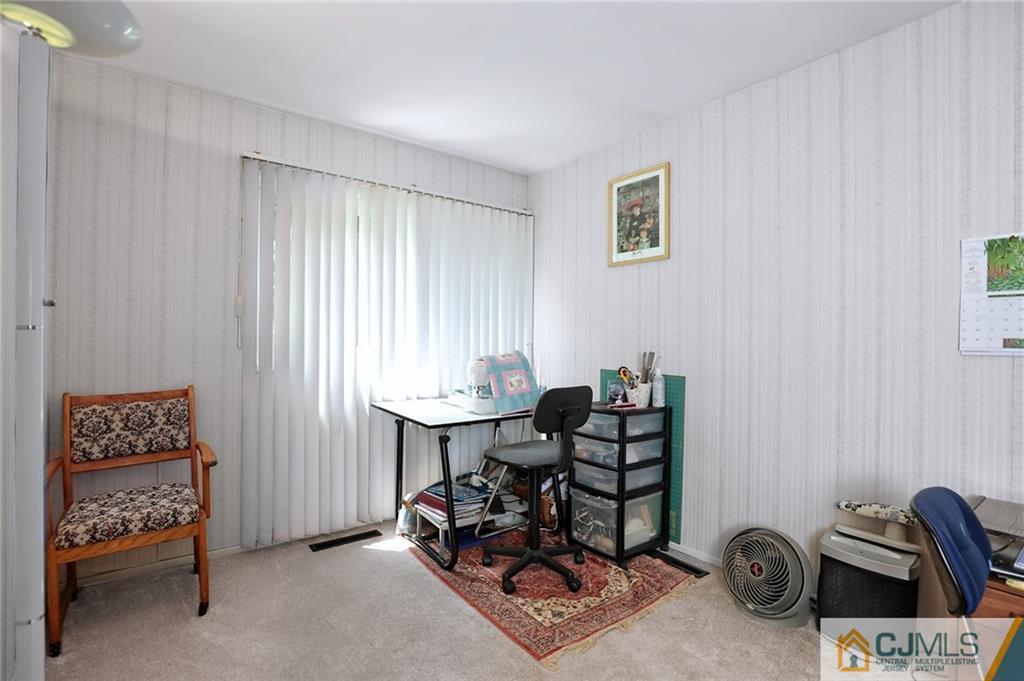 16 Joline Road Kendall Park, NJ 08824 - Photo 18 of 23 a bedroom with furniture and a window