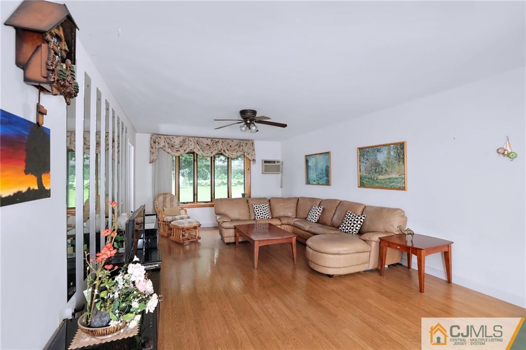16 Joline Road Kendall Park, NJ 08824 - Photo 5 of 23 a living room with furniture and a large window