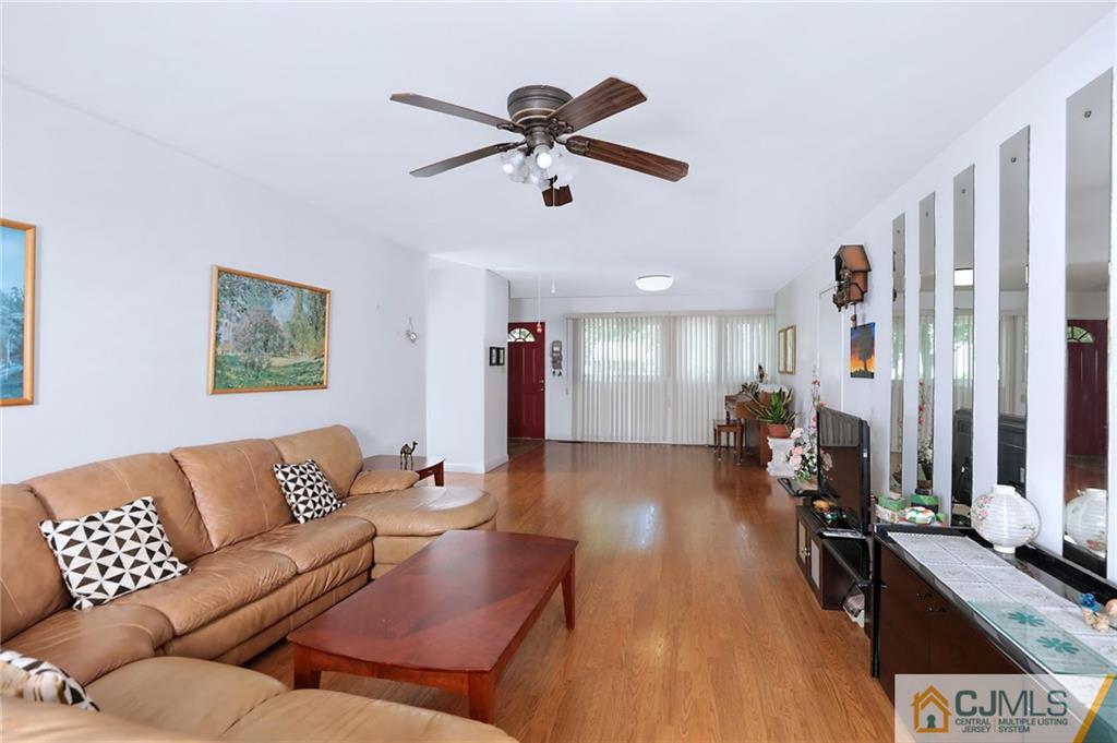 16 Joline Road Kendall Park, NJ 08824 - Photo 7 of 23 a living room with furniture and a large window