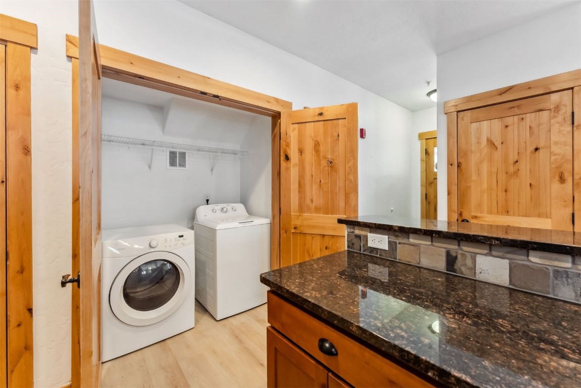 35 Tip Top Trail, Unit 6500 Keystone, CO 80435 - Photo 15 of 47 a bathroom with a sink a washer and dryer next to a window