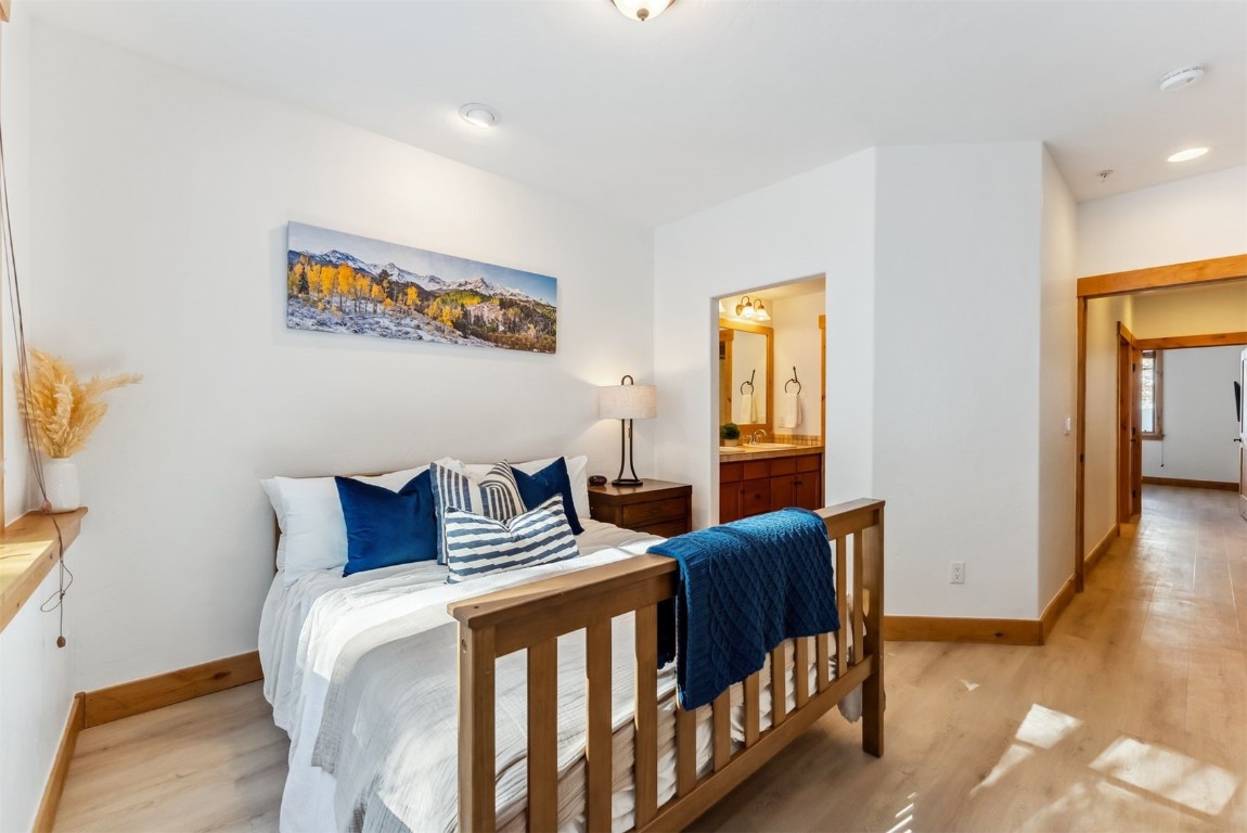35 Tip Top Trail, Unit 6500 Keystone, CO 80435 - Photo 17 of 47 a bedroom with furniture and wooden floor