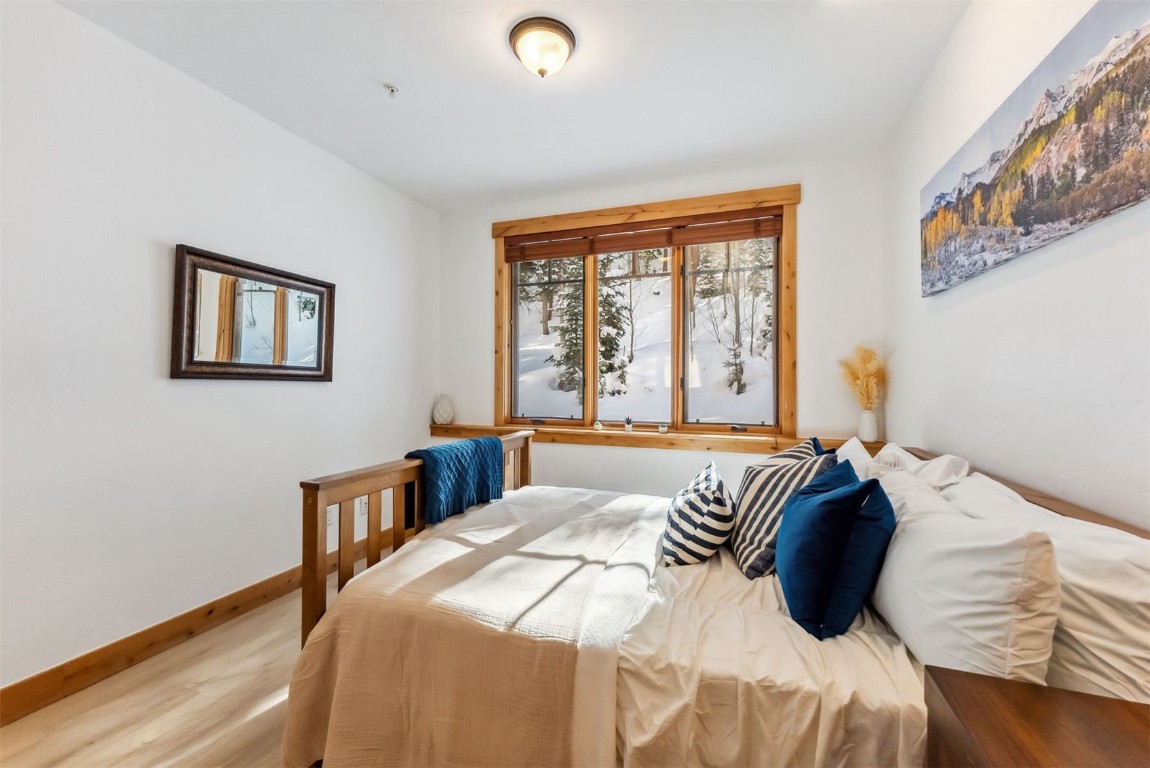 35 Tip Top Trail, Unit 6500 Keystone, CO 80435 - Photo 18 of 47 a bedroom with a bed and a large window