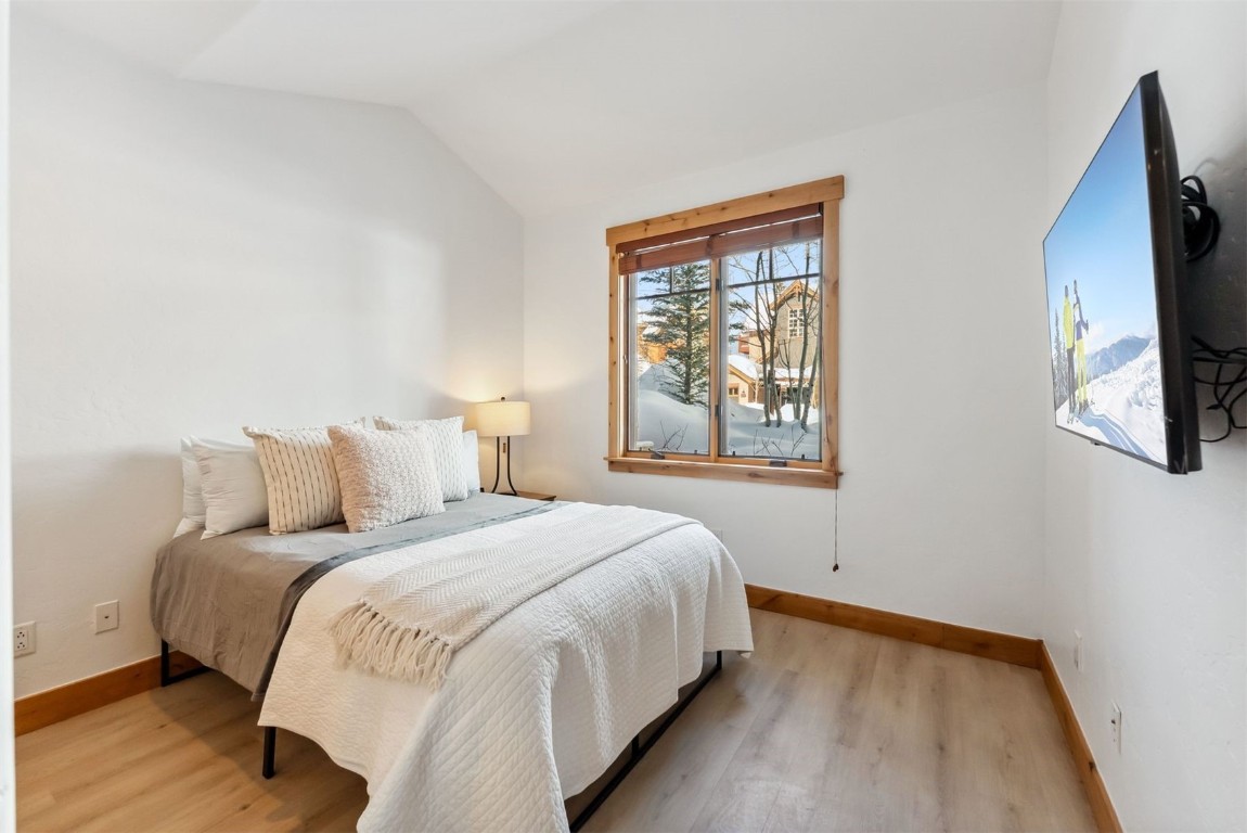 35 Tip Top Trail, Unit 6500 Keystone, CO 80435 - Photo 25 of 47 a bedroom with a bed and a flat tv screen on a dresser