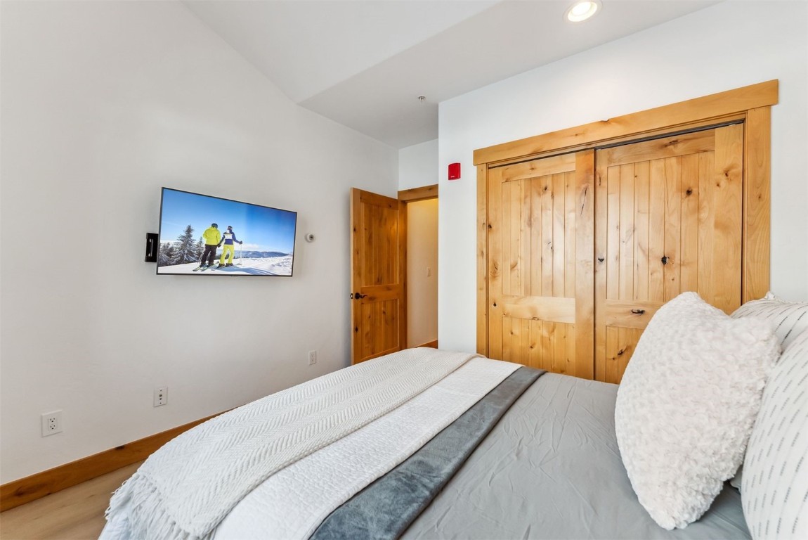 35 Tip Top Trail, Unit 6500 Keystone, CO 80435 - Photo 26 of 47 a bedroom with a bed and a painting on the wall