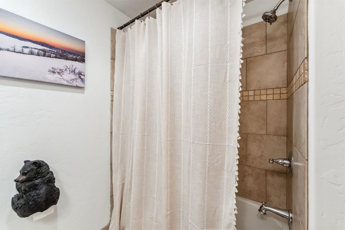 35 Tip Top Trail, Unit 6500 Keystone, CO 80435 - Photo 29 of 47 a bathroom with a shower curtain and a curtain