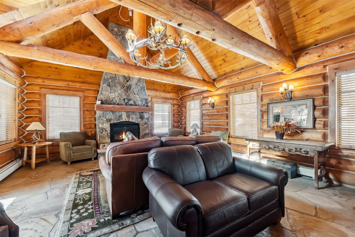 35 Tip Top Trail, Unit 6500 Keystone, CO 80435 - Photo 42 of 47 a living room with furniture a fireplace and a flat screen tv