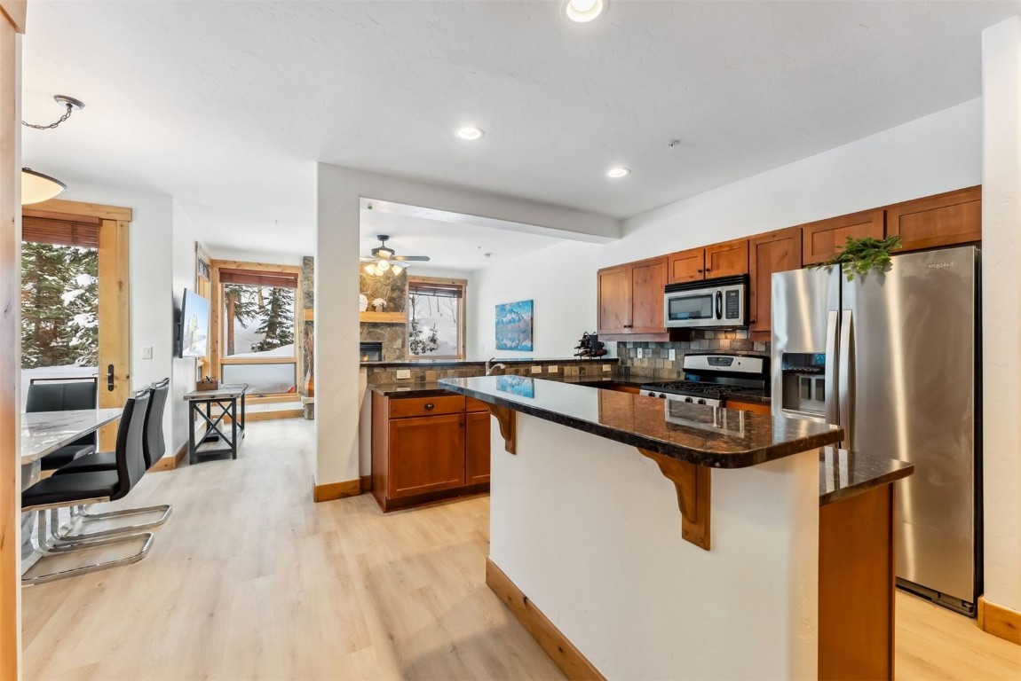 35 Tip Top Trail, Unit 6500 Keystone, CO 80435 - Photo 6 of 47 a kitchen with stainless steel appliances granite countertop a refrigerator a stove and a sink