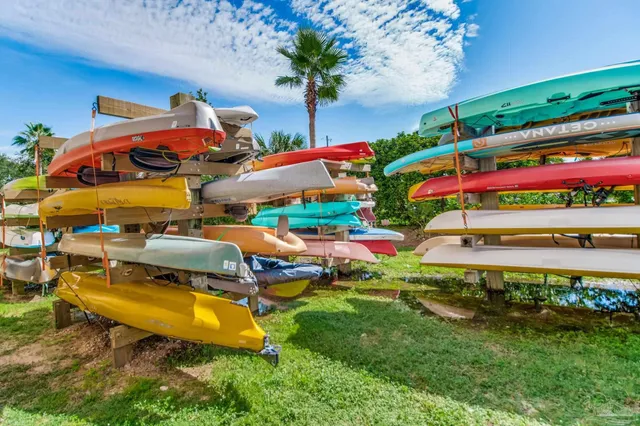 a view of a swimming pool with a table and chairs